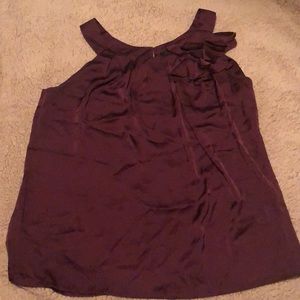 Burgundy colored blouse with floral embellishment